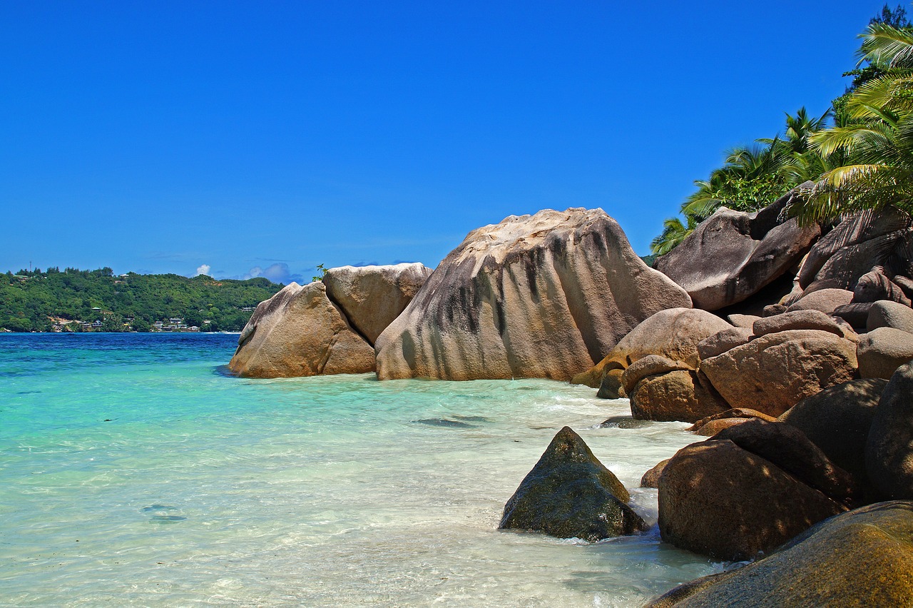Granite boulders beside a turquoise beach in the Seychelles